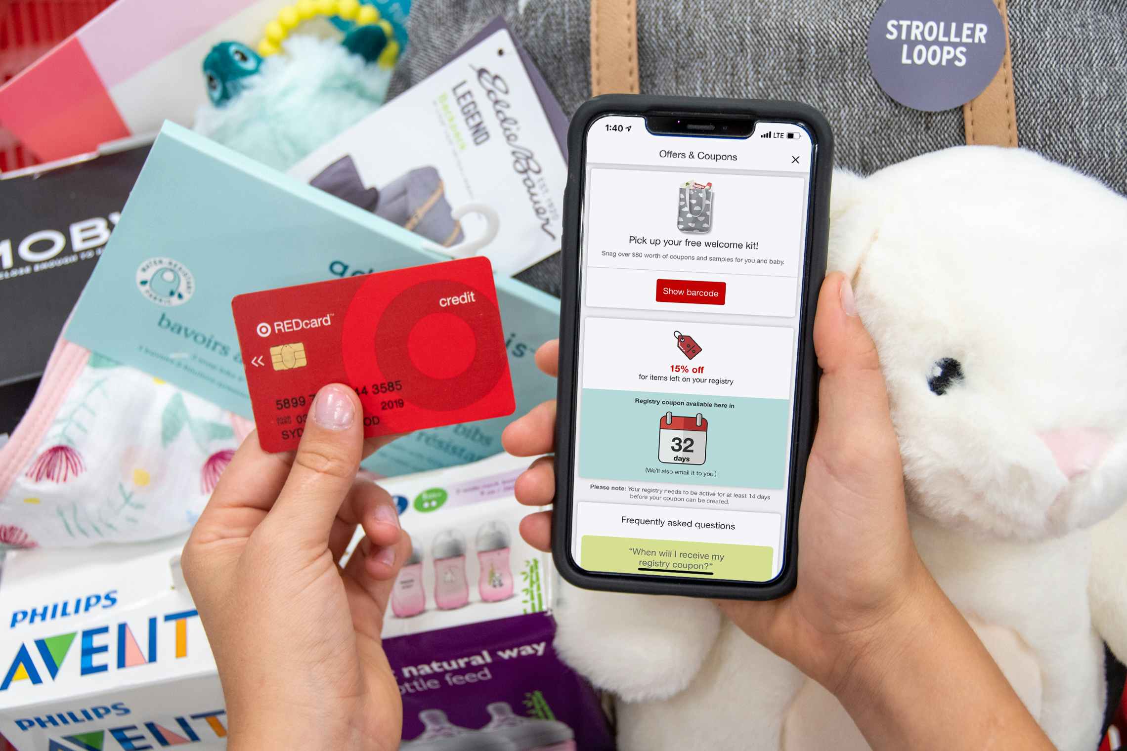Target baby registry app coupon and red card next to a basket filled with baby items.