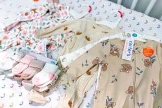 carter's baby apparel laying in a crib at target