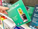 hand grabbing a nutribullet personal blender off a target shelf