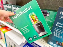 hand grabbing a nutribullet personal blender off a target shelf