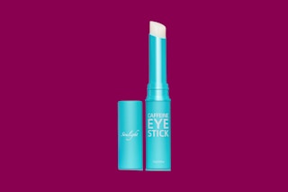 a caffeine eye stick on a magenta background