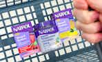 hand holding basket with natrol sleep supplements