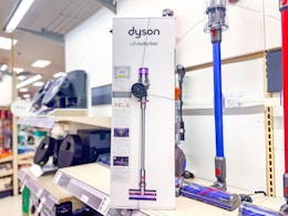 dyson v9 cordless stick vacuum sitting on a target shelf