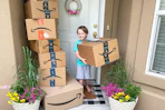 a kid near amazon delivery boxes