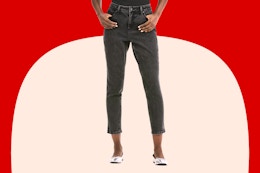 Close up shot of model wearing a pair of Time and Tru Mom Jeans in the color "washed black"
