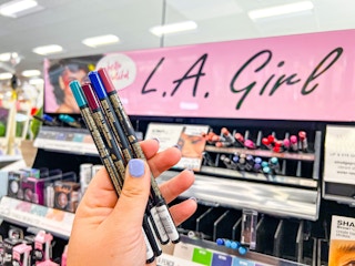 hand holding liner pencils