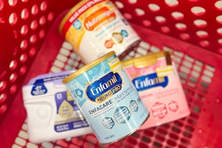 infant formula clearance tubs stacked in a shopping cart