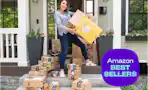 amazon boxes on a porch with joanie holding amazon packages