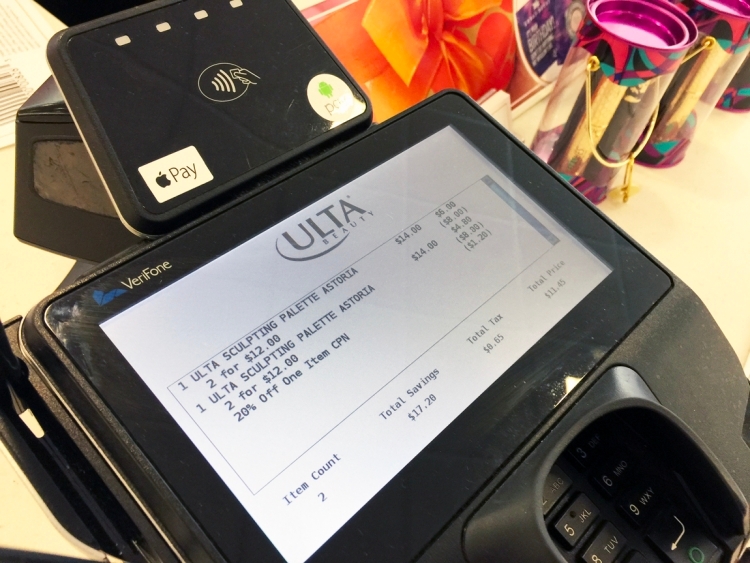 Ulta checkout counter with card reader showing purchase