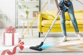 a person vacuuming the floor