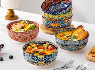 colorful bowls full of food on a table