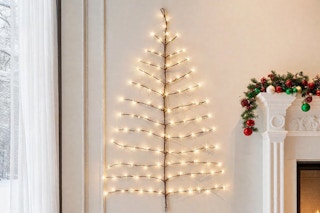 Hairui Lighted Brown Wall Tree 4FT 108 Warm White LED Lights on a wall hanging.
