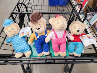 bernstain bear plushes in a cart