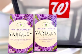 two packages of soap bars on store counter in front of shopping basket with walgreens logo