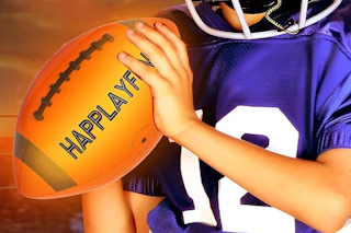 a boy holding a football