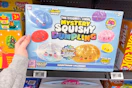 hand holding rms mystery squishy dumplings calendar
