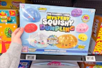 hand holding rms mystery squishy dumplings calendar