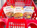3 del real foods entrees sitting in a target cart