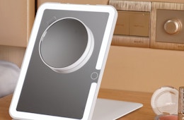 a travel mirror on a table