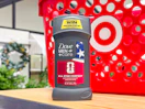 hand holding a dove men+care deodorant in front of target basket