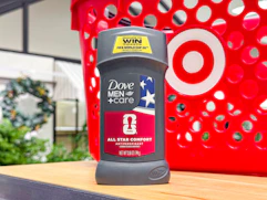 hand holding a dove men+care deodorant in front of target basket