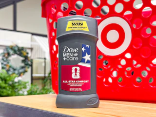 hand holding a dove men+care deodorant in front of target basket
