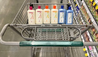 a variety of andalou shampoo and conditioner in a cart at whole foods