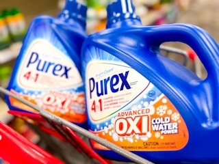 two bottles of purex laundry detergent in a shopping cart