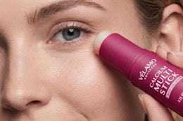 a woman using a calcium multi-stick