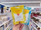 hand holding burt's bees face mask in walgreens