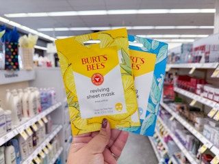 hand holding burt's bees face mask in walgreens