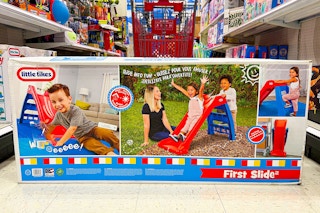 little tikes slide sitting in front of a target cart