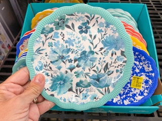 hand holding pioneer woman teal floral appetizer plates at walmart