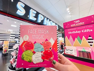 A person's hand holding up a Sephora holiday gift set.
