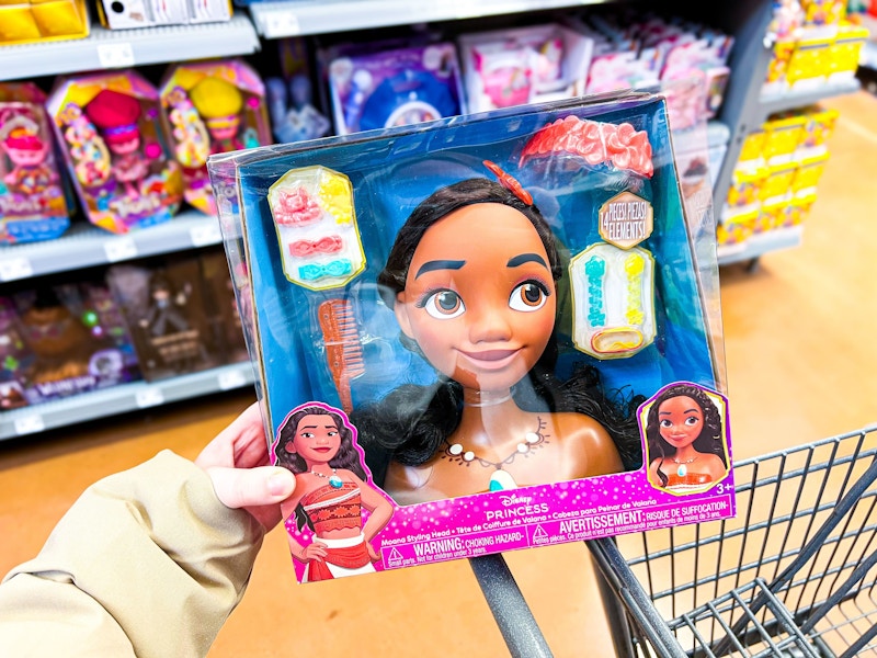 hand holding disney moana styling head on walmart cart