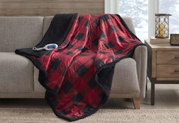 oversized heated throw blanket sitting on a couch