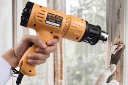SEEKONE Heat Gun 1800W being used to heat a wall.
