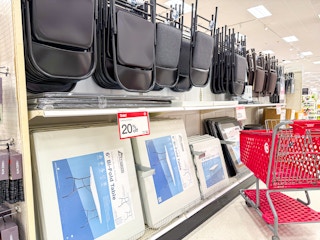 folding banquet tables and chairs sitting on target shelves