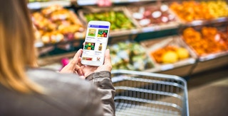 person looking at the flashfood app on their iphone