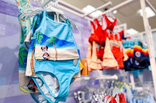 kids' swimsuits sitting on a target rack