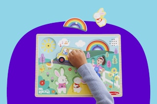 Lifestyle image of the  Ms. Rachel Meliisa & Doug Wooden Puzzle being played with my a child (close up shot)