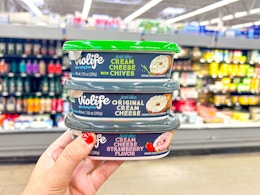 hand holding the Violife cream cheese containers