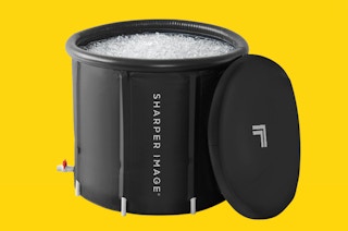 a cold plunge ice bath on a yellow background 