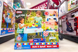 little tikes deluxe water table sitting in front of a target cart