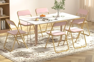 Lifestyle image of pink Nefoso Velvet Folding Chairs 6-pack in home setting