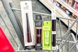 elf makeup in a cart: eyeliner, brow tint, lip balm, and pout clout lip pen