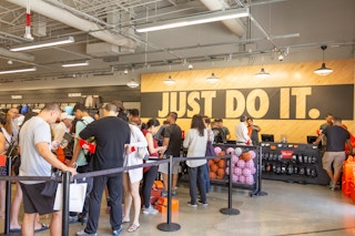 Nike store check out with customers waiting to be helped