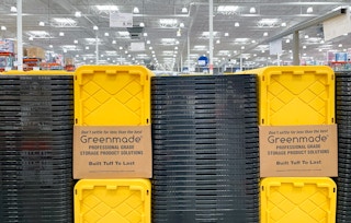 storage bins and lids stacked up with sale sign at costco