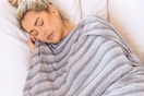 a woman using a cooling blanket