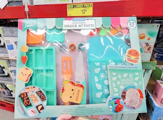 hand holding a food prep set for kids